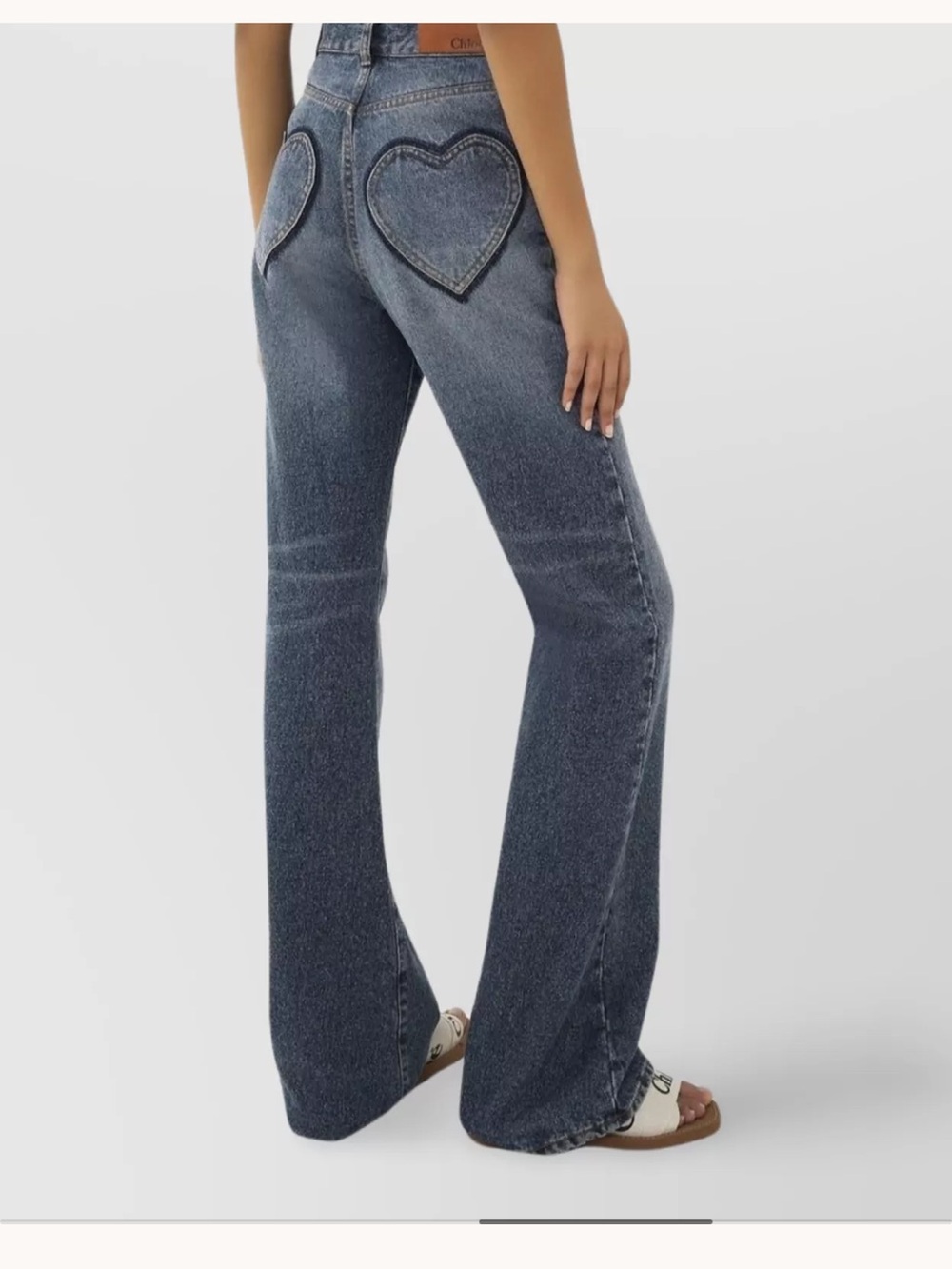 Chloe’ FLARED SILHOUETTE DENIM TROUSERS WITH HEART-SHAPED POCKETS